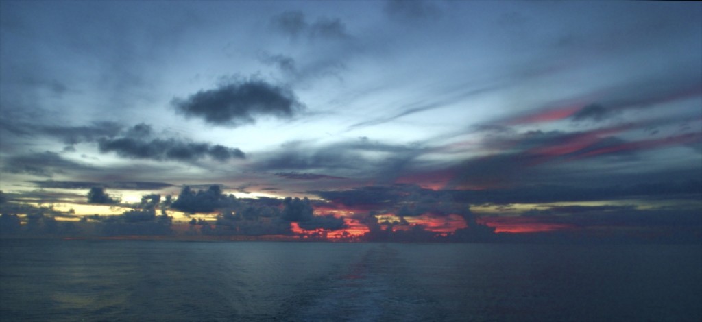 Sunset off the stern of the boat