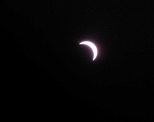 As the eclipse geeks below begin to celebrate, the moon slowly moves along.