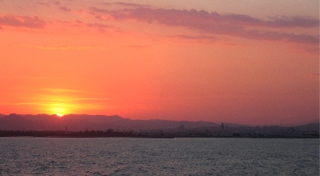 Sunset over barcelona, from the ferry